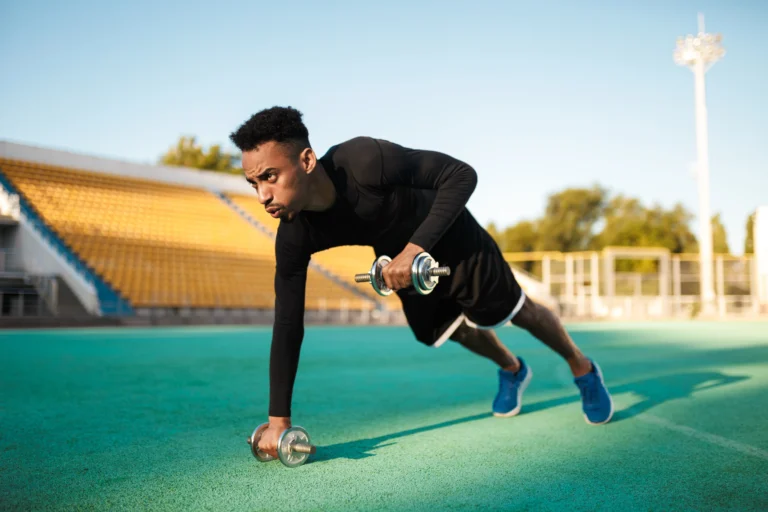 young-strong-african-american-sportsman-doing-exercises-with-dumbbells-workout-city-stadium